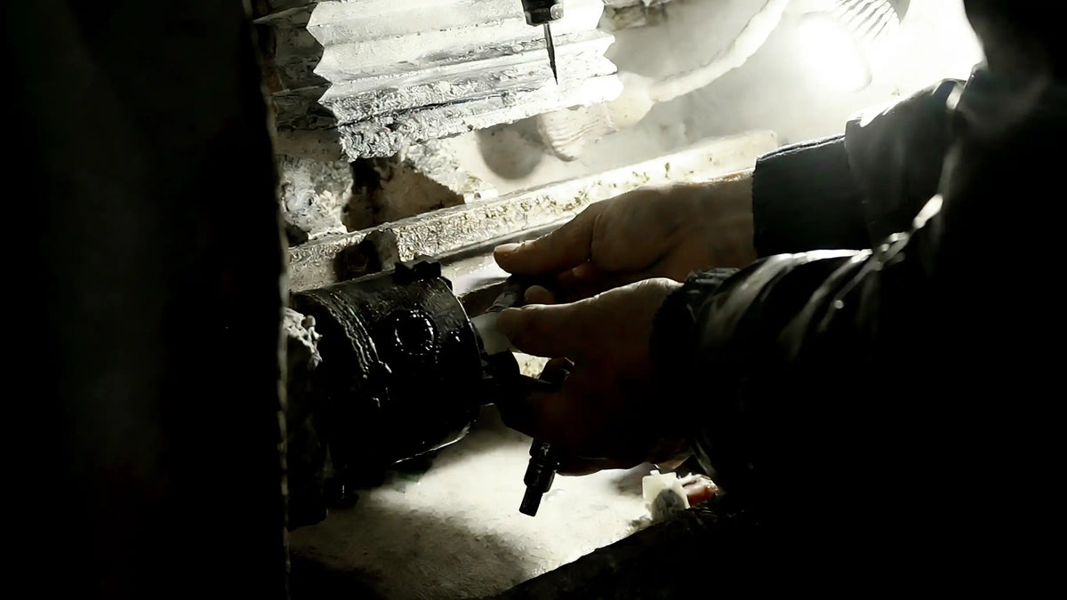 Artisan working at a crystal cutting machine